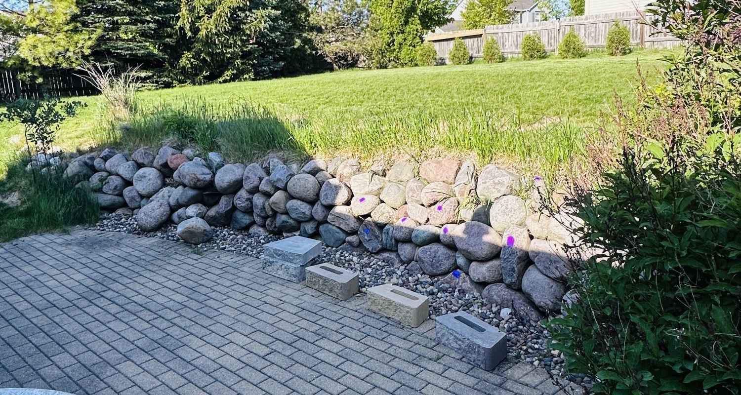 Prepping the land for gravel and stone.