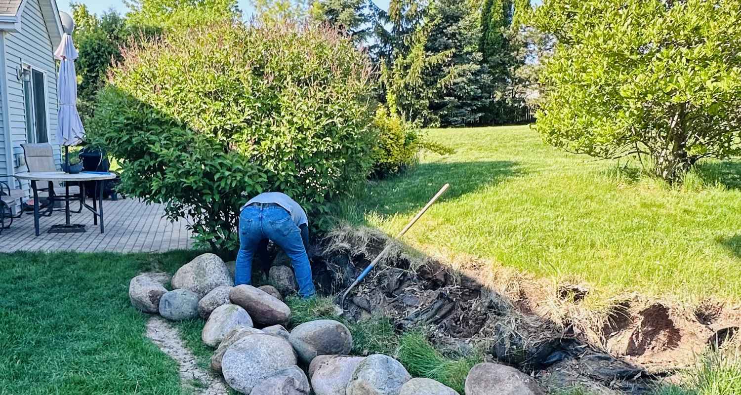 Prepping the land for gravel and stone.