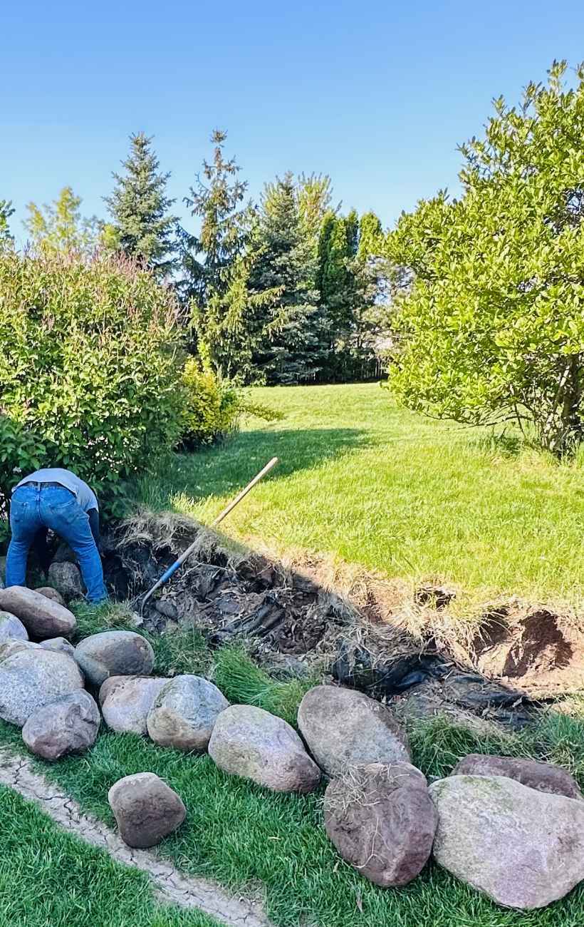 Prepping the land for gravel and stone.
