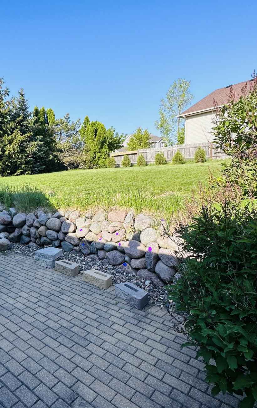 Prepping the land for gravel and stone.