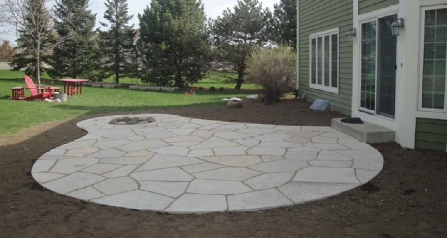 View of finished patio and fireplace.