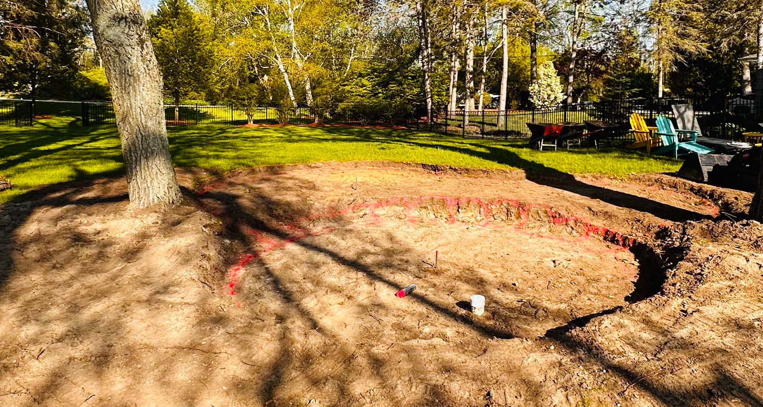 Prepping the land for gravel and stone.