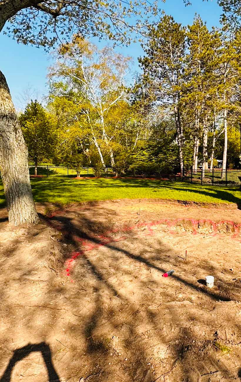 Prepping the land for gravel and stone.