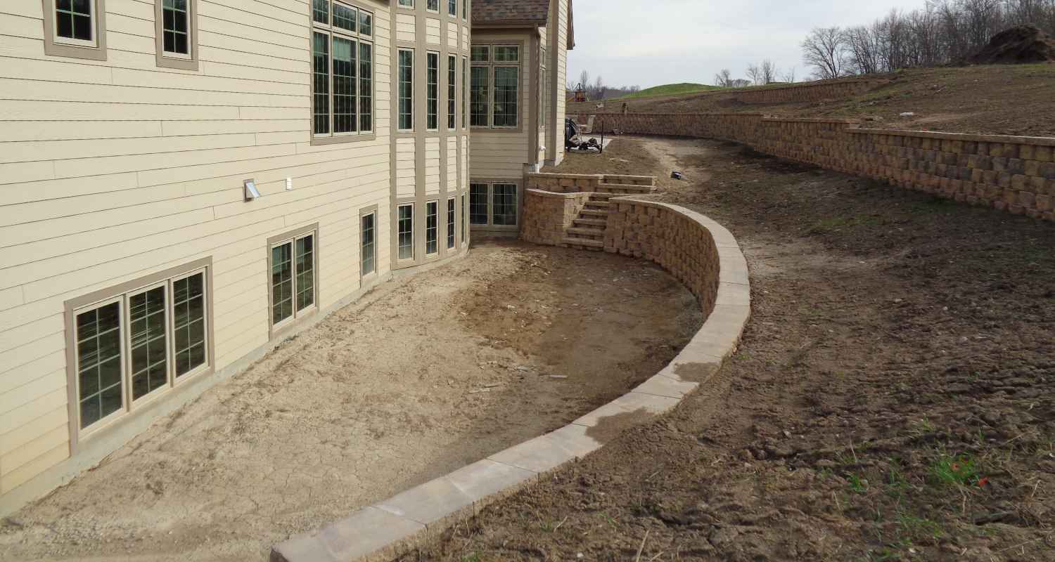 Prepping the land for gravel and stone.