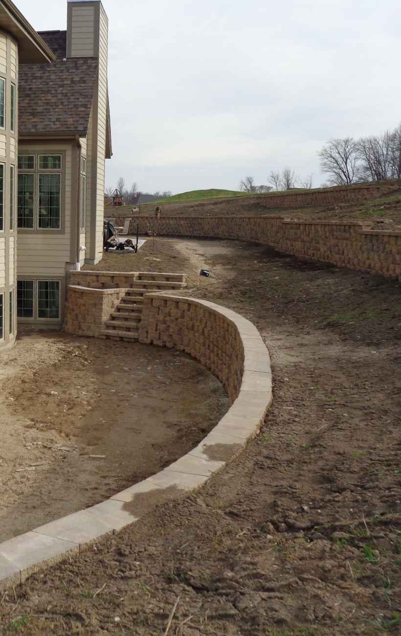 Prepping the land for gravel and stone.