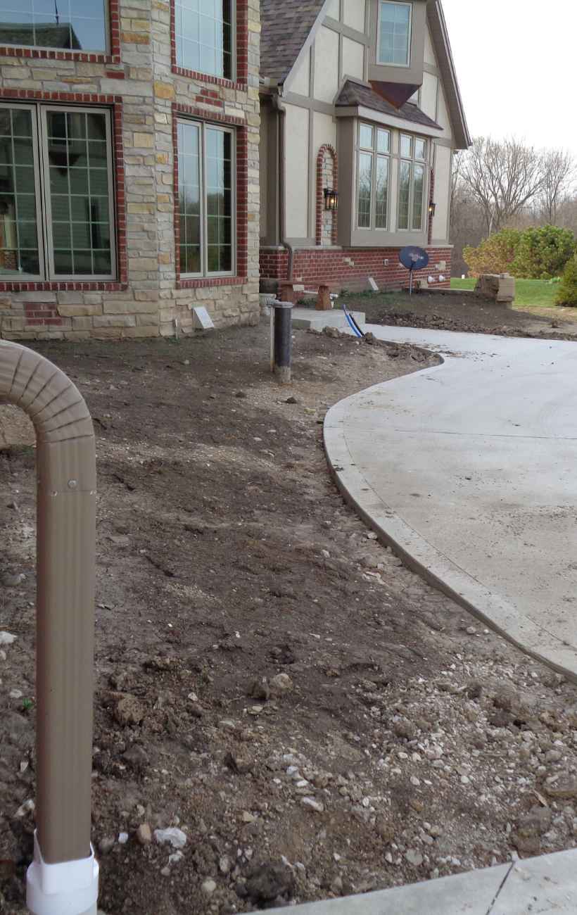 Prepping the land for gravel and stone.