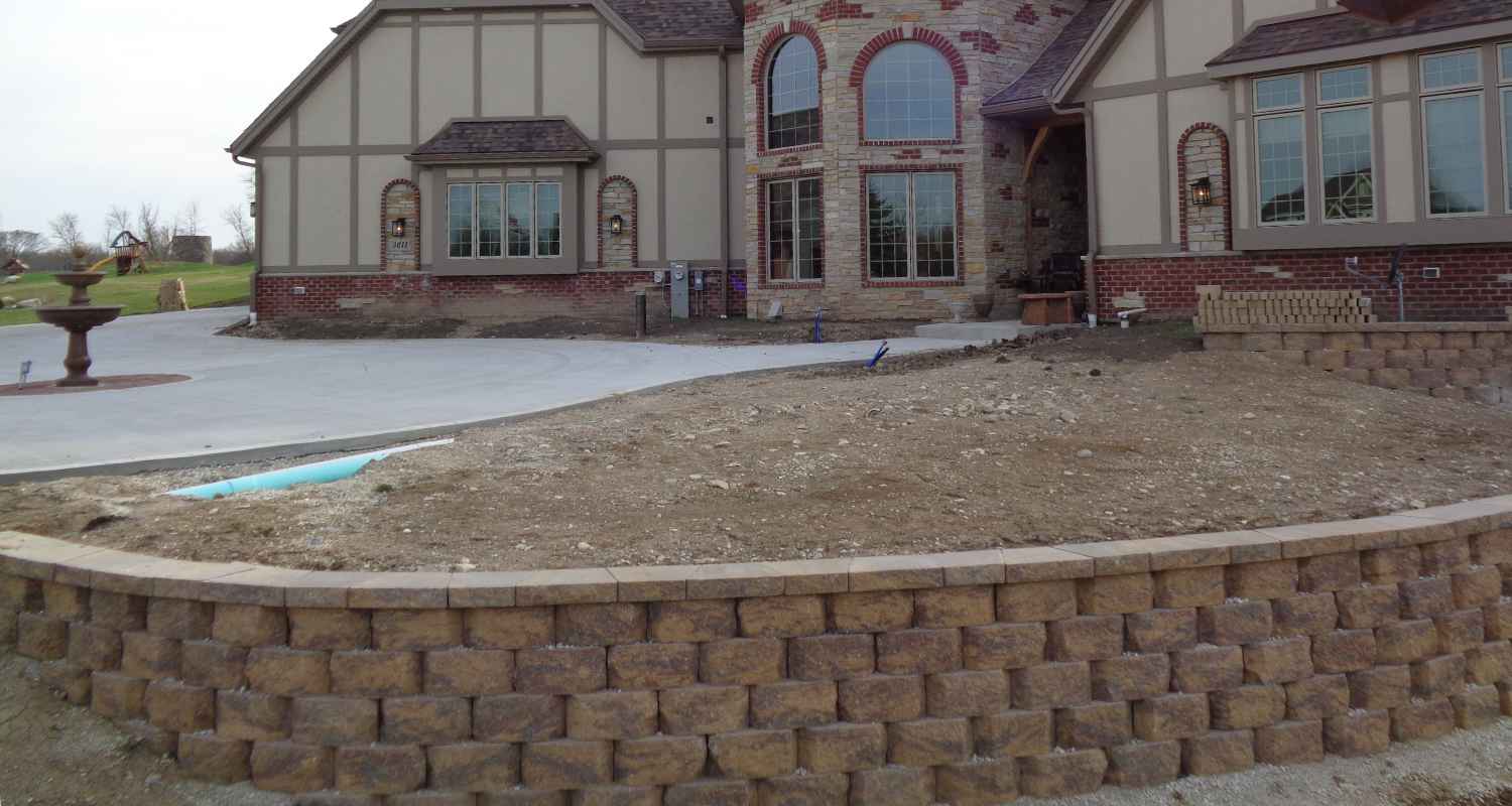 Prepping the land for gravel and stone.