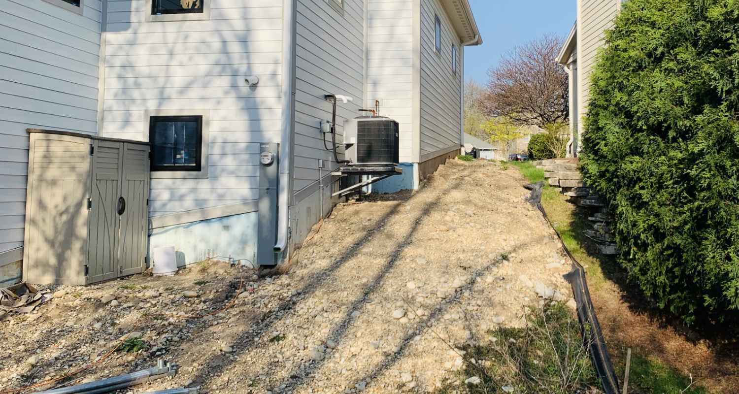 Prepping the land for gravel and stone.