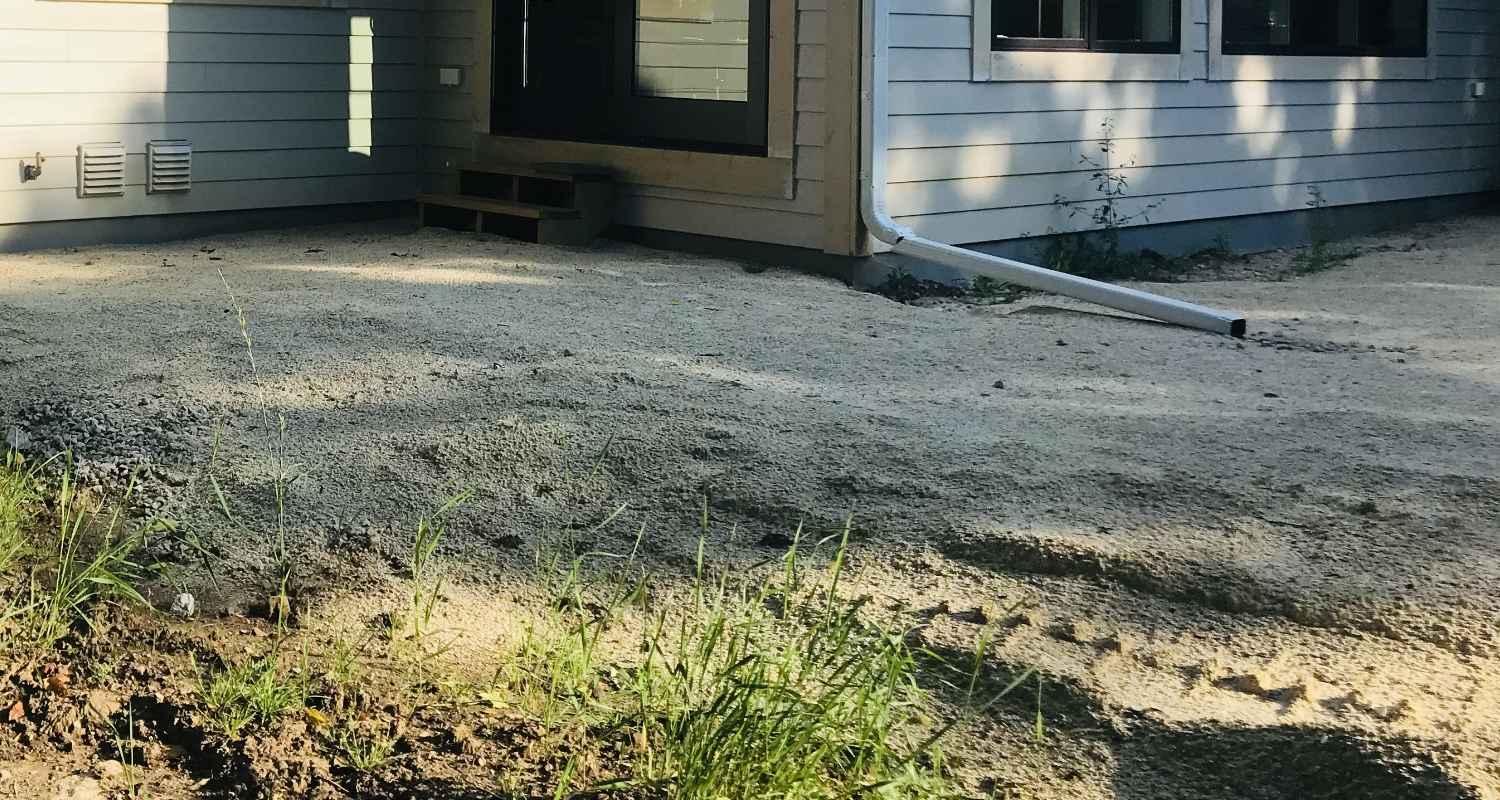 Prepping the land for gravel and stone.
