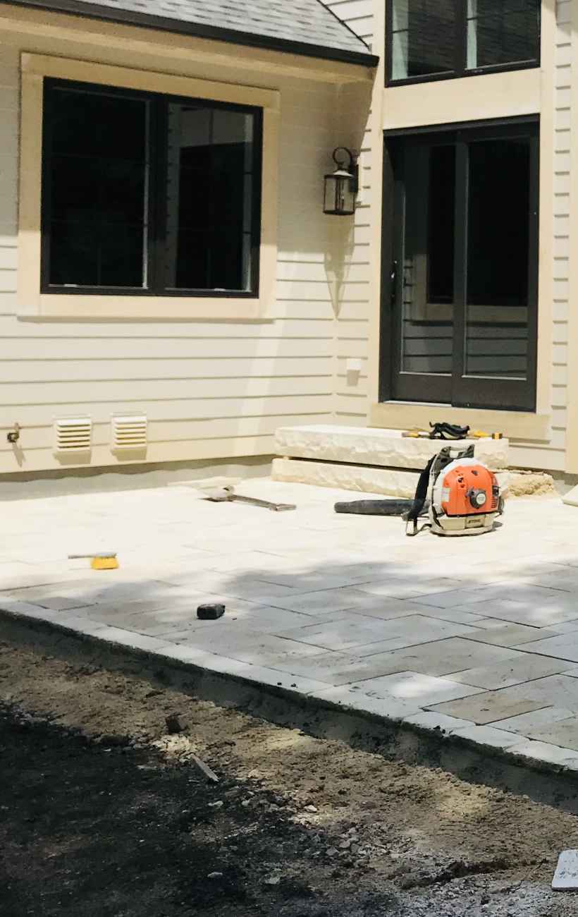 View of finished patio and fireplace.
