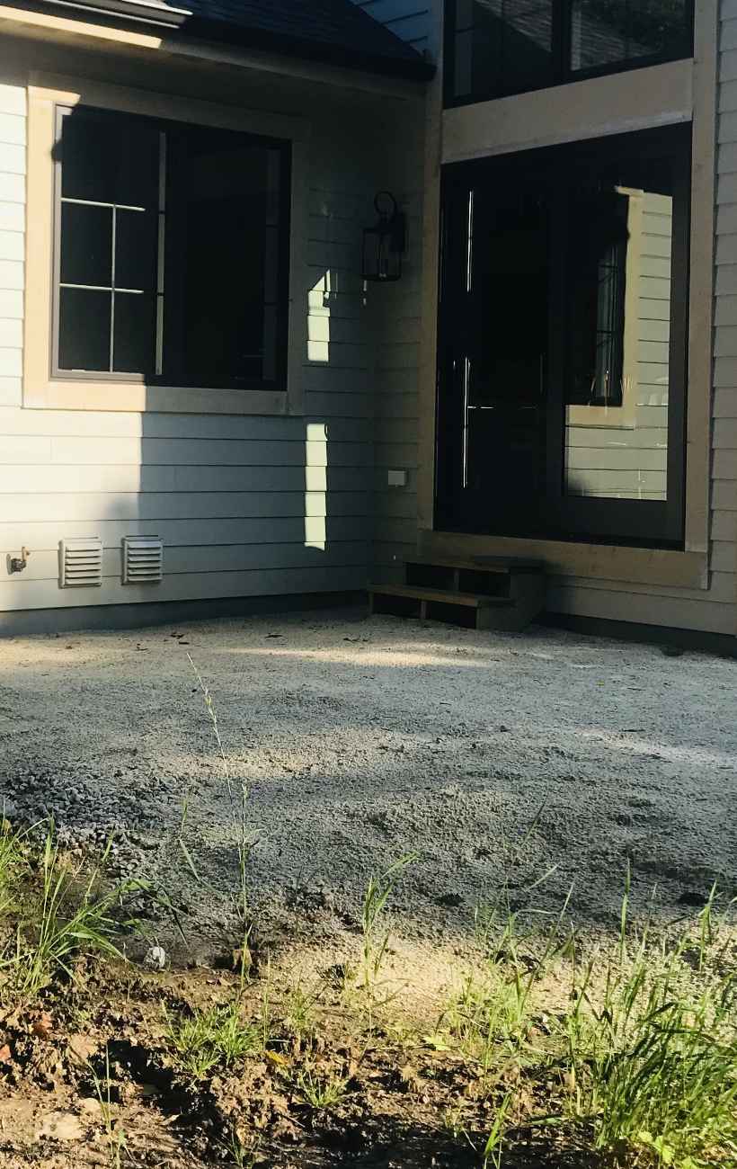 Prepping the land for gravel and stone.